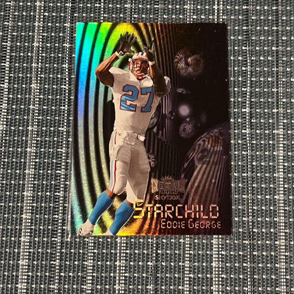 1999 🌸 Eddie George Metal
Universe "Starchild" Card Sports Trading Card #SC19